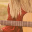 Person playing a guitar