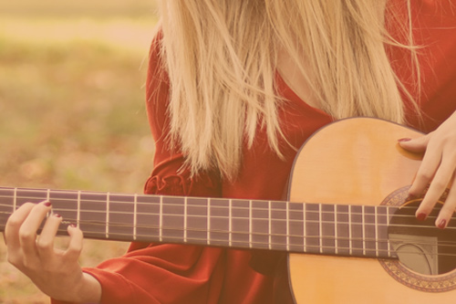 Person playing a guitar