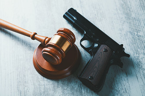 American Current Events, Justice Court gavel with a gun on the table