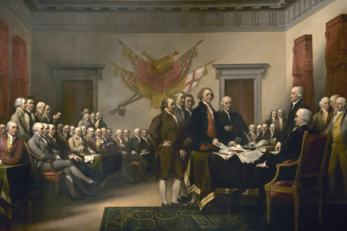 American founding fathers stand ready to sign the Declaration of Independence