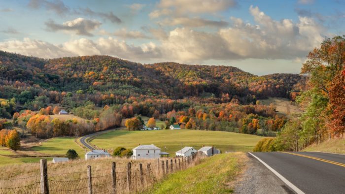 Curving road mountain valley houses