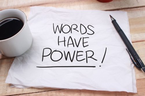 Piece of paper has the words: Words Have Power!
