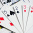 Assorted play cards and combinations on isolated white background close up view