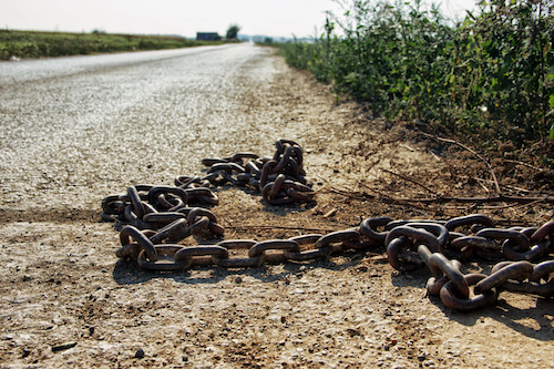 Rusty Metal Chain on Road