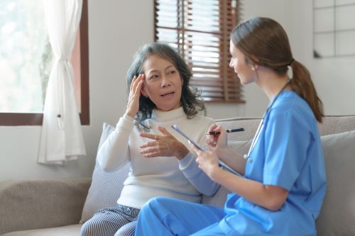 woman speaking with female doctor
