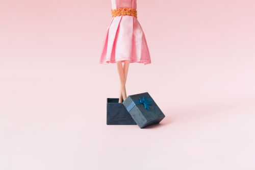 barbie doll coming out of a box
