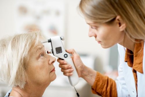 Photo of doctor examing a woman's eyes