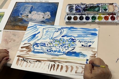 Photo of a person working on a watercolor picture