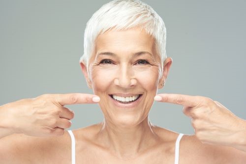 Smiling woman showing her healthy teeth