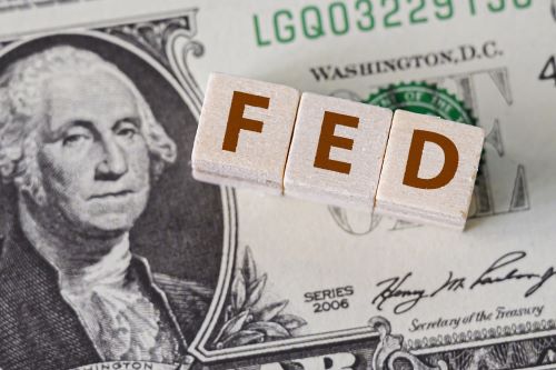 Image of dollar bill with the word FED on top of it