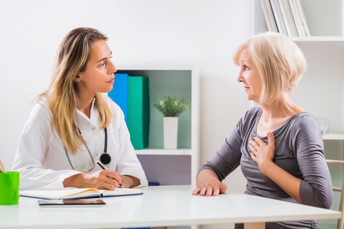 Photo of woman talking to her doctor