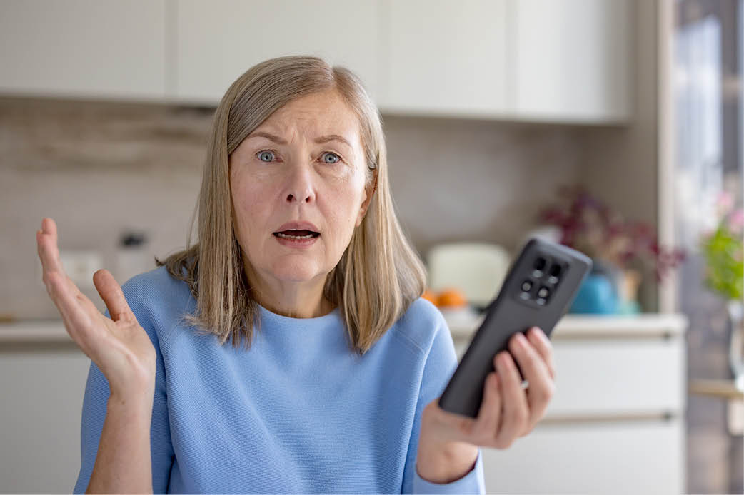 Woman holding smartphone Woman holding smartphone