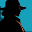 Silhouette of woman wearing a fedora