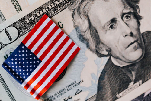American flag and 20 dollar bill zoomed in on Andrew Jackson