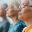 group of women meditating