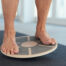 person balancing on round workout equipment
