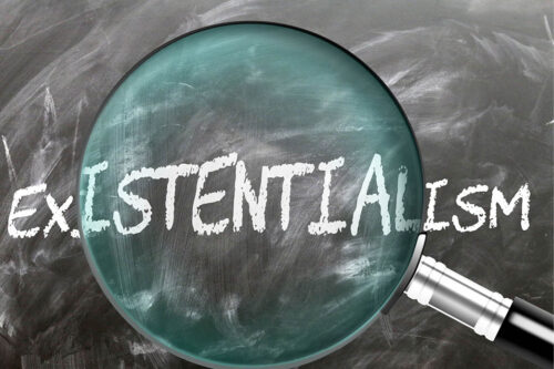 magnified glass highlighting the word "existentialism"