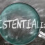 magnified glass highlighting the word "existentialism"