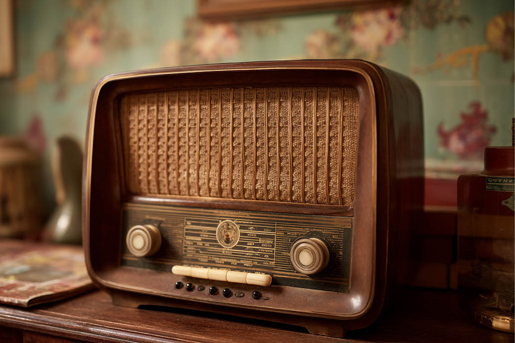 Murrow Boys and Radio brown retro radio sitting on vanity