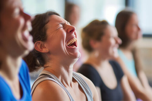 women laughing in yoga class