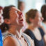 women laughing in yoga class
