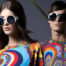female and male model in matching colorful outfit and sunglasses