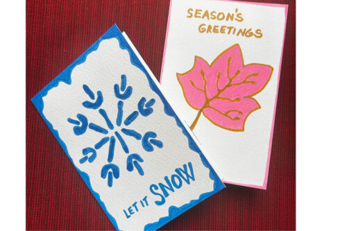 2 seasonal greeting cards, one with a snowflake and the other with a red leaf