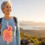 Women at top of mountain with digestive organs highlighted