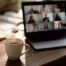 Coffee cup next to a Zoom screen