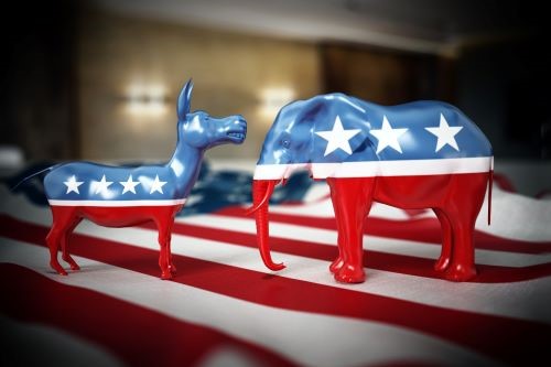 Donkey and elephant facing each other, each are painting in American flag colors
