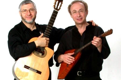 Photo of a guitar player and a balalaika player